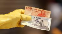 Taiwan dollar eases after historic surge as officials deny currency talks with U.S.