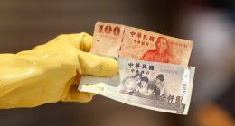 Taiwan dollar eases after historic surge as officials deny currency talks with U.S.