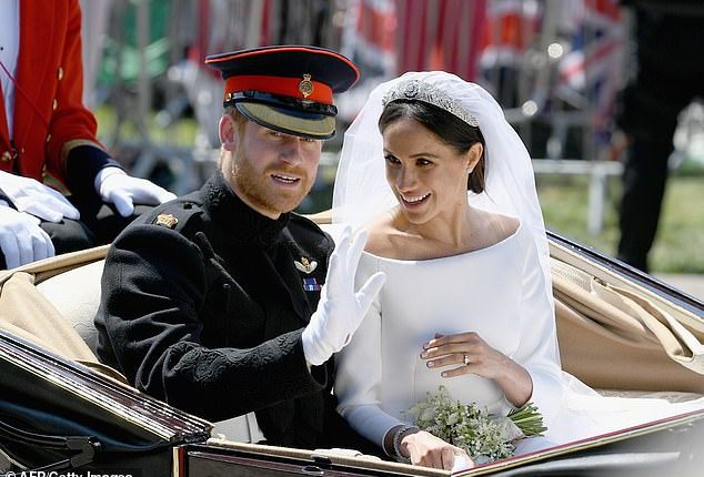 Prince Harry and Meghan on their wedding day in May 2018. A royal biographer has claimed the Queen was shocked by Harry's behaviour before and after the marriage