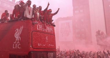 Liverpool Premier League champions on a parade bus.