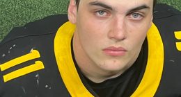 Photo of Austin Metcalf in a football jersey.