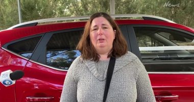 Woman giving an interview, visibly upset.
