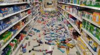 Store aisle with products scattered on the floor after an earthquake.