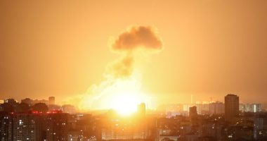 Ballistic missile explosion over a city at night.
