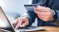 An alleged online scammer has been charged by Victoria police after evading authorities for over ten years.