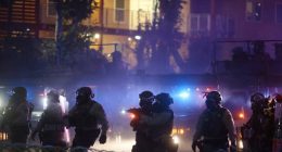 After tear gas and street fires, an Los Angeles community cleans up as National Guard troops arrive