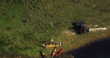 Aerial view of kayakers and a damaged kayak after an alligator attack.