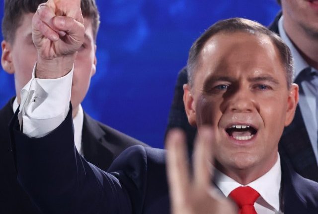 Karol Nawrocki, Law and Justice party candidate, giving a victory sign.