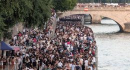 PARIS, FRANCE - JUNE 21: Thousands of people gather at the Chatelet district and on the banks of the Seine to celebrate Fete De La Musique 2025 as bands and DJ's play across Paris, France on June 21, 2025. (Photo by Luc Auffret/Anadolu via Getty Images)