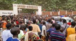 Crowd gathered outside Barthelemy Boganda High School following a stampede.