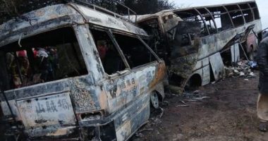 Burned-out buses after a fatal collision.