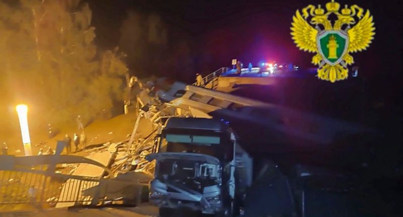 Rescue workers at the site of a train derailment in Bryansk, Russia.