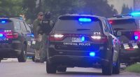Police cars at a shelter-in-place scene.
