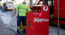 Adelaide, Australia - 18 Feb 2021: A Australia Post postmen is collecting the post from the mail box.