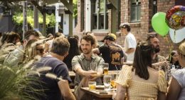 People drinking in a beer garden.