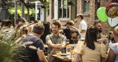 People drinking in a beer garden.