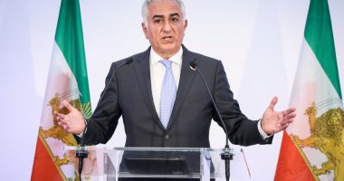 Reza Pahlavi giving a press conference.