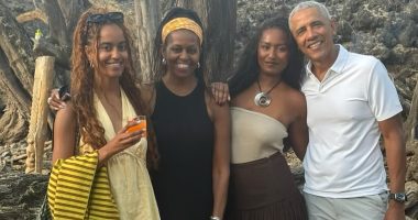 Barack and Michelle Obama put on brave face with daughters