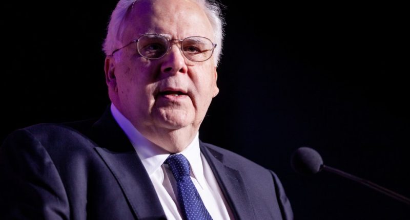 Frederick Smith, FedEx CEO, speaking at a podium.