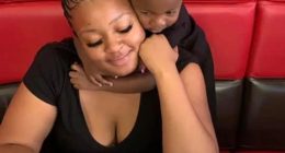 Woman holding her child.