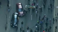 Car drives through anti-ICE protesters as Chicago joins nationwide anti-ICE unrest amid Trump crackdown