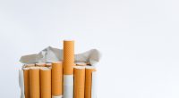Open pack of cigarettes standing upright.