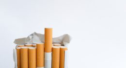 Open pack of cigarettes standing upright.