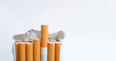 Open pack of cigarettes standing upright.