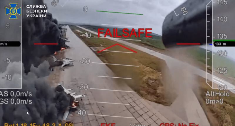 Drone footage of burning planes on a runway.