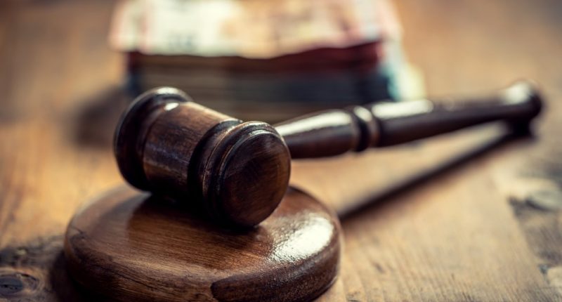 Judge's gavel and euro banknotes representing judicial corruption.