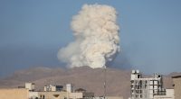 Smoke plume rising over Tehran after an Israeli attack.