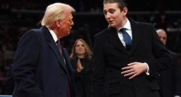 Donald Trump speaking with his son, Barron Trump.