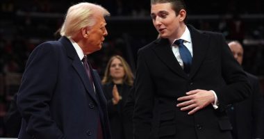 Donald Trump speaking with his son, Barron Trump.