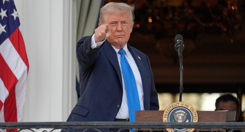 President Donald Trump speaking and gesturing.