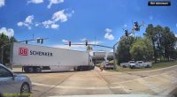 Dramatic dashcam video shows truck crash injure worker, left dangling over I-12 in Denham Springs, Louisiana