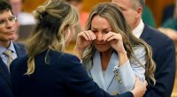 Woman crying in court after hearing murder trial verdicts.