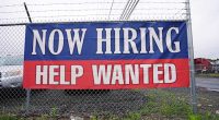 Fewer Americans sought unemployment benefits last week as layoffs remain low