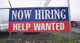 Fewer Americans sought unemployment benefits last week as layoffs remain low