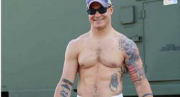 Photo of Travis Decker, showing his tattoos and physique.