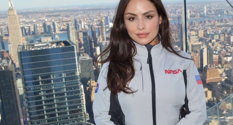 Laysa Peixoto in a NASA jacket overlooking New York City.