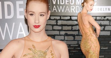 Golden wonder: Iggy Azalea wows on the red carpet in see-through gold dress at the VMAs