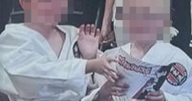 Image of Max and Sam Johnson in karate uniforms, faces blurred.