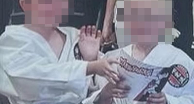 Image of Max and Sam Johnson in karate uniforms, faces blurred.