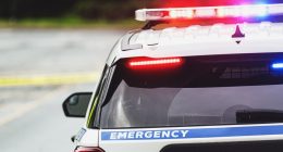 Rear view of a police car at an emergency scene.