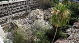 Rescue workers at the site of a missile strike in Tel Aviv.