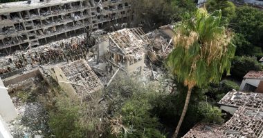 Rescue workers at the site of a missile strike in Tel Aviv.