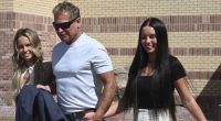 Barry Morphew leaves a Fremont County court building in Canon City, Colorado, with his daughters Macy (left) and Mallory (Rright) after charges against him in the presumed death of his wife were dismissed on April 19, 2022. (Jerilee Bennett/The Gazette via AP, File)