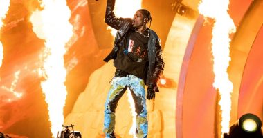 Travis Scott performing at a music festival.