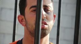 Lieutenant Muath al-Kasaesbeh, a Jordanian pilot, behind bars.
