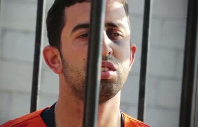 Lieutenant Muath al-Kasaesbeh, a Jordanian pilot, behind bars.